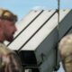 NATO and Latvia Air Force personnel near NASAMS air defense system