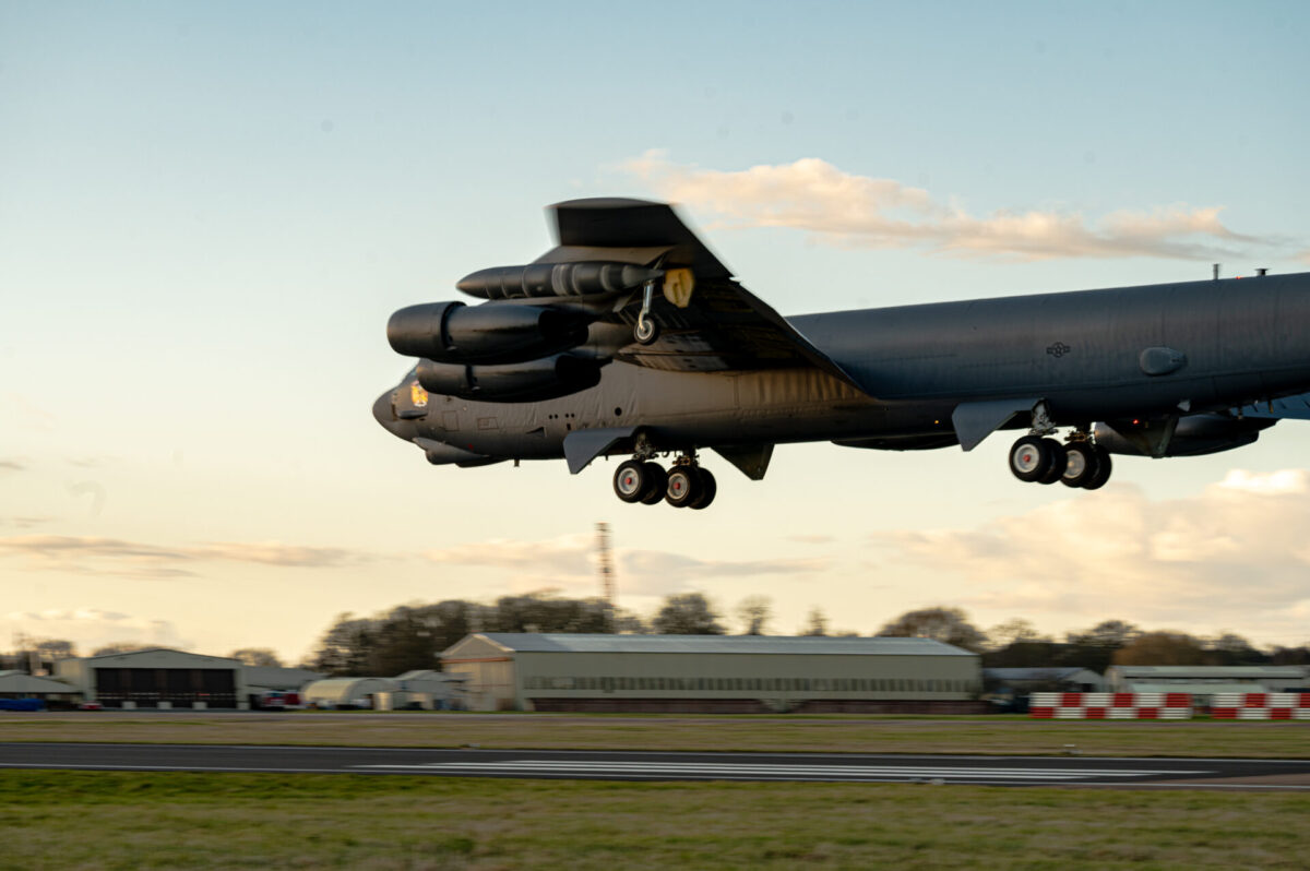 B 52 Stratofortresses return from Bomber Task Force operations C 17 Globemaster III lifting off from a runway at an airbase landing gear down sunset sky behind it
