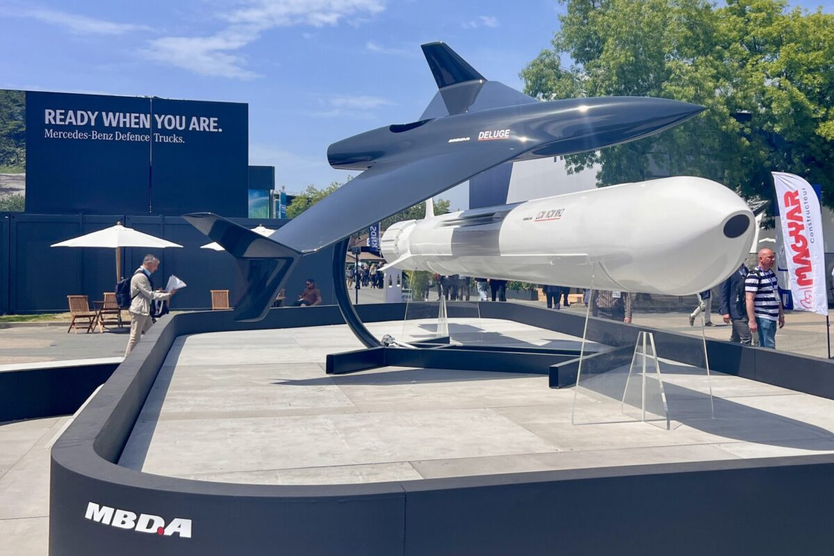 IMG 6484 Outdoor defense expo display featuring a sleek unmanned aircraft labeled Deluge on a stand with an MBDA booth and a blue Ready When You Are backdrop behind