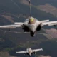 Two Rafale fighter jets flying in formation above France