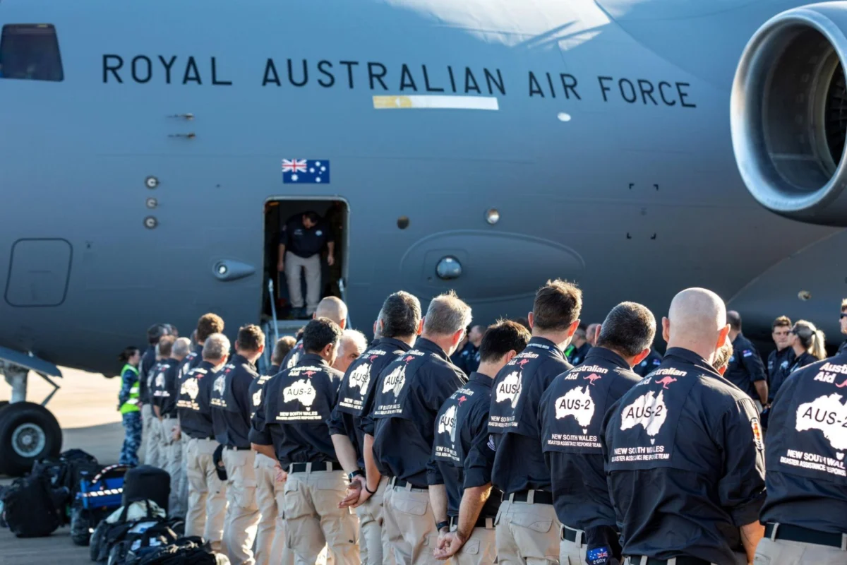 Inside the logistics of Australias C 17A Globemaster fleet Line of Australian Defence Force personnel queueing to board a Royal Australian Air Force transport aircraft