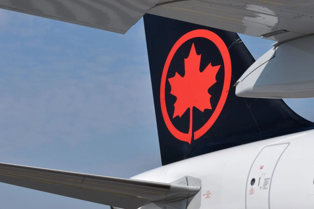 Former Air Canada pilot penalized over incorrect license Rear of an Air Canada airplane with a black tail featuring a bright red maple leaf logo a wing in the foreground