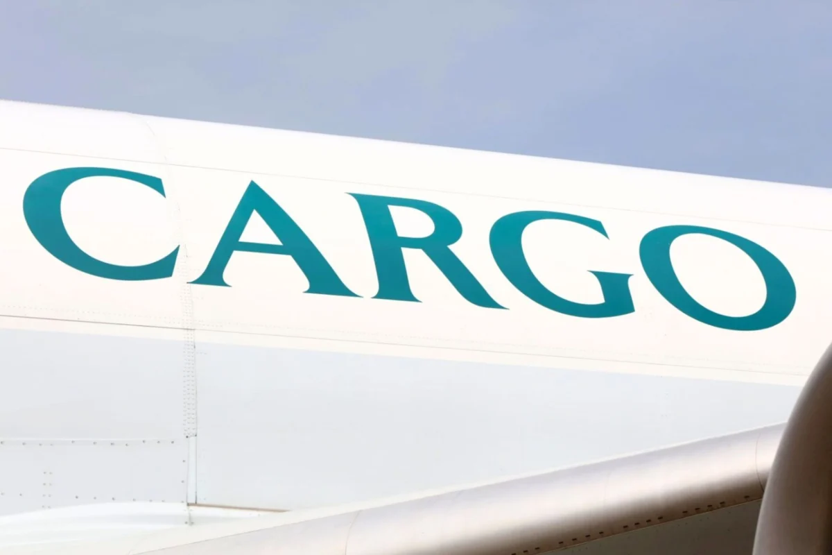 Cathay Group adds A330 freighter to Air Hong Kong fleet Close up of a white cargo aircraft fuselage with large turquoise letters spelling CARGO against a blue sky