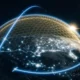Planet encased in a glowing hexagonal energy shield with blue orbital lines against a starry space backdrop