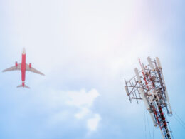 5G post and plane on sky background