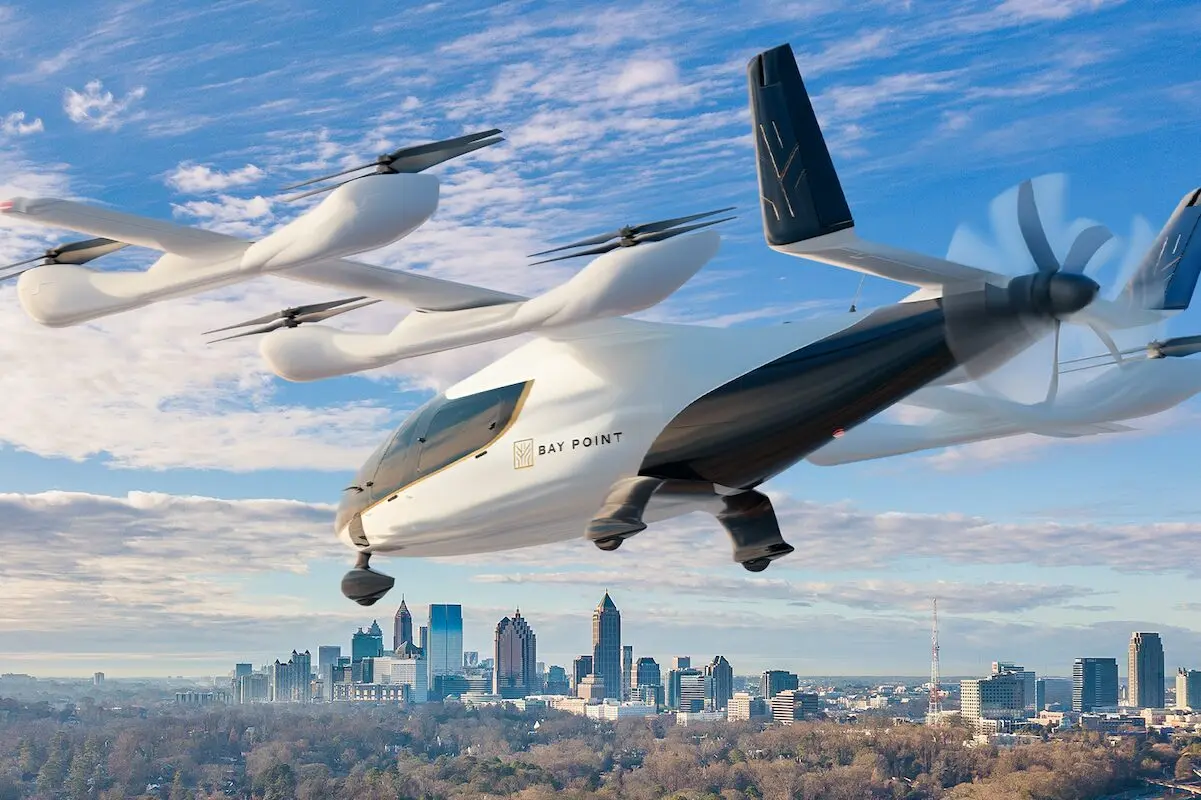 BayPoint Eve2026 Futuristic white VTOL flying car labeled Bay Point hovering over a city skyline on a clear day