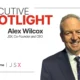 Executive Spotlight banner featuring Alex Wilcox JSX Co Founder and CEO with his portrait on the right and sponsor logos at the bottom left