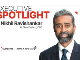 Executive Spotlight banner featuring Nikhil Ravishankar CEO of Air New Zealand with a partial headshot on the right