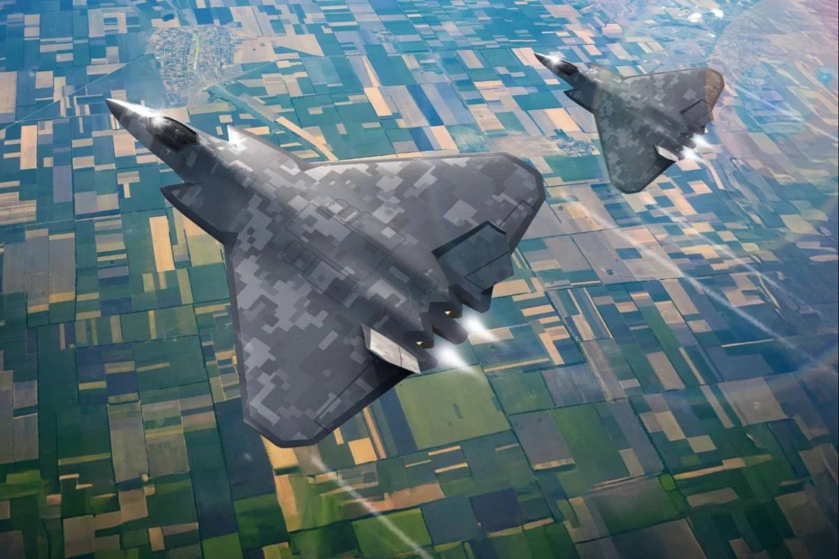 Two stealth bombers flying in formation over patchwork farmland seen from above