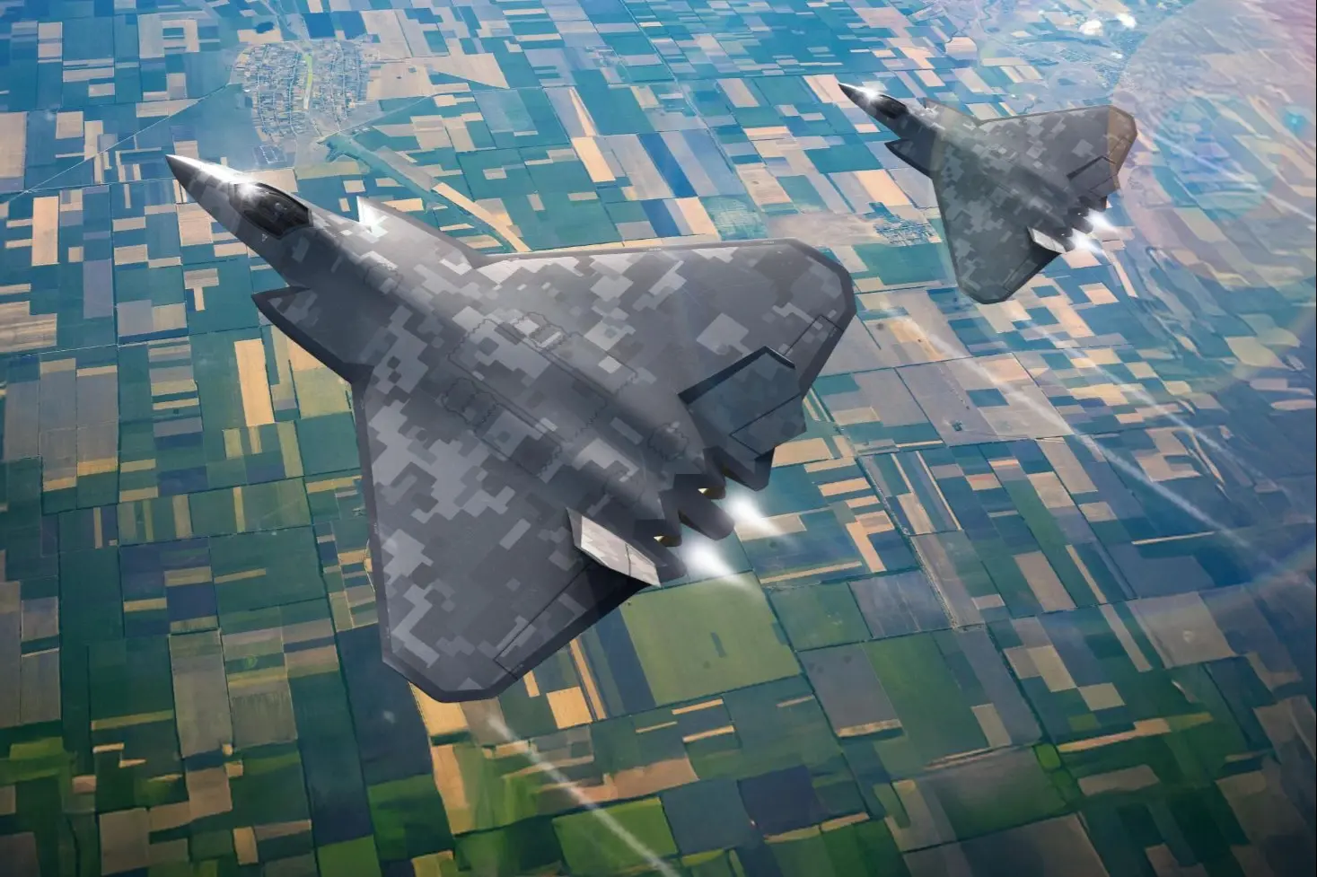 Two stealth bombers flying in formation over patchwork farmland seen from above