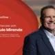 AeroTime interview banner featuring the subject LATAM Airlines VP smiling man in a dark suit on the right against a red background