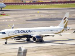 StarLux jet on the taxiway at the airport with a Philippines Airlines plane visible in the background