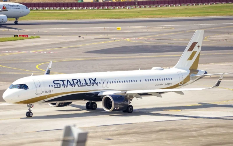StarLux jet on the taxiway at the airport with a Philippines Airlines plane visible in the background
