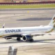 StarLux jet on the taxiway at the airport with a Philippines Airlines plane visible in the background