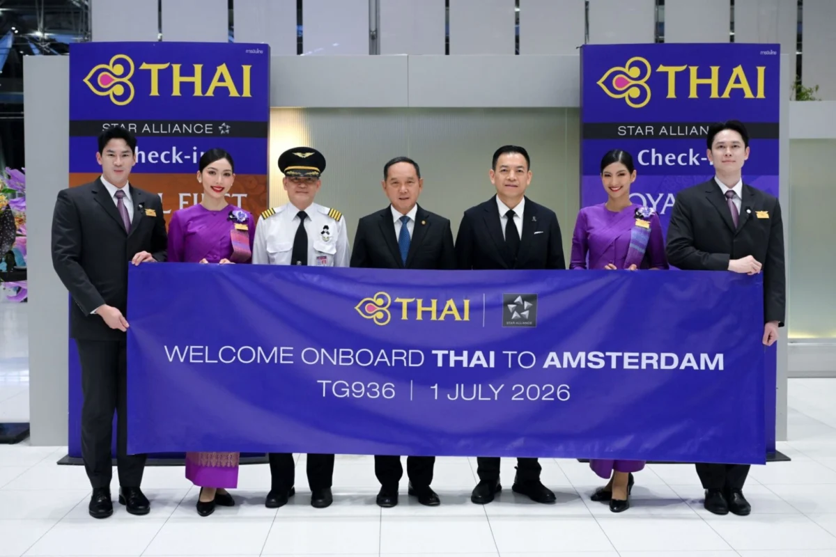 Thai Airways returns to Amsterdam after 28 year hiatus Group of six individuals in formal attire posing behind a large THAI banner at a THAI event Amsterdam welcome sign visible