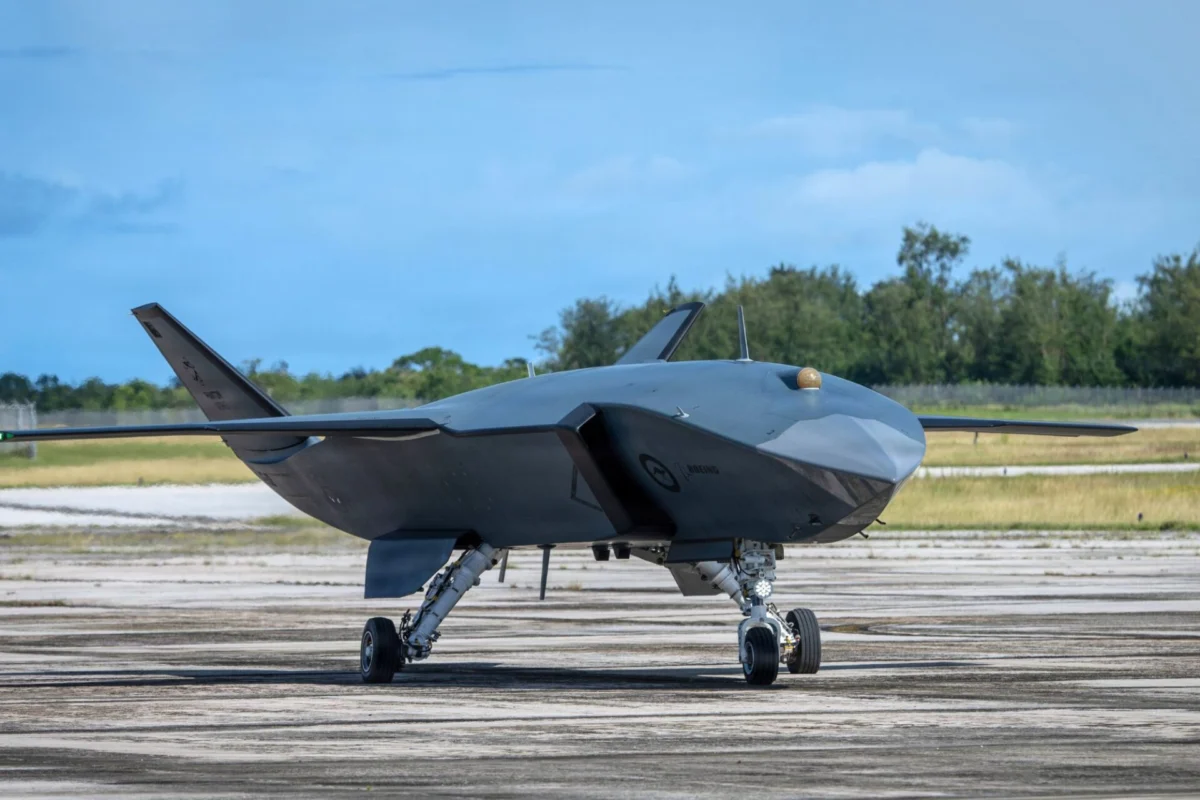 MQ 28A Ghost Bat makes exercise debut at Valiant Shield Stealth drone aircraft on a runway gray delta wing body with tail fins and landing gear visible