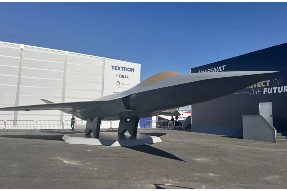France Germany seek new defense ties after project collapse Large aircraft wing mounted on pedestals at an outdoor exhibition with white walls and Textron signage in the background under a blue sky