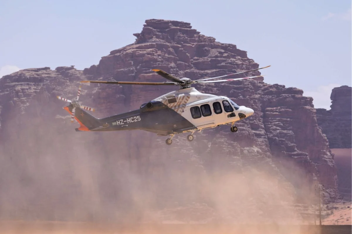 The Helicopter Company orders 11 more Leonardo AW139s Passenger helicopter lifting off over a dusty desert with rocky cliffs in the background