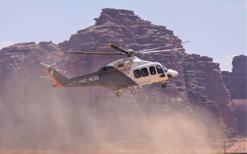 The Helicopter Company orders 11 more Leonardo AW139s Passenger helicopter lifting off over a dusty desert with rocky cliffs in the background