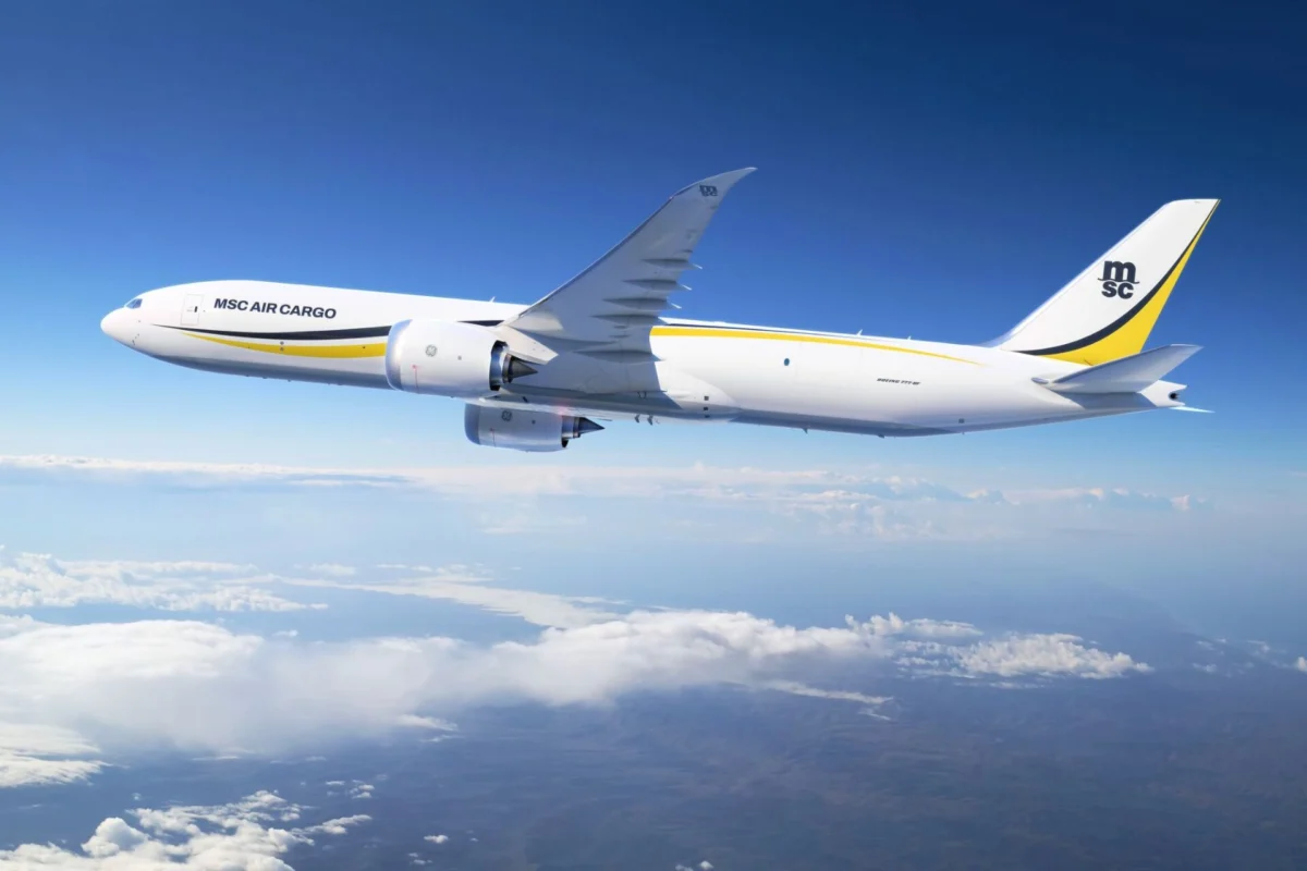 MSC Air Cargo orders five B777 8s at Farnborough 2026 White MSC Air Cargo Boeing 777 freighter flying above clouds against a blue sky yellow and black tail logo visible