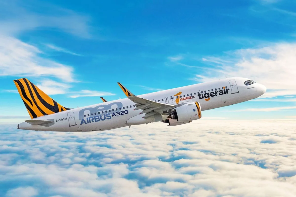 Tigerair Taiwan picks GTF engines for 15 more A321neos Airbus A320 jet with tiger stripe tail livery flying above a cloudy blue sky