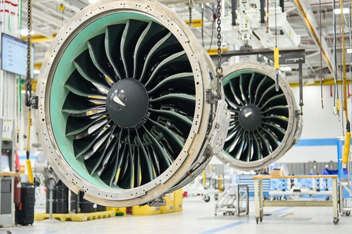 BOC Aviation orders up to 220 Pratt Whitney GTF engines Two large jet engine nacelles suspended in a maintenance hangar showing turbine blades in view