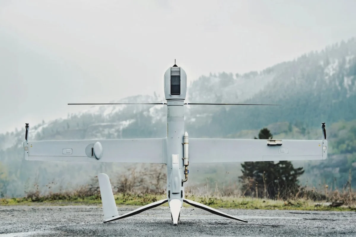 Airbus U030 Flexrotor begins Baltic Sea operations Unmanned aerial vehicle on a ground launch platform white body with long wings against a mountainous backdrop