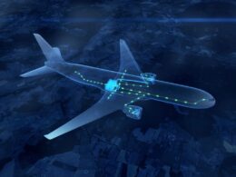 Transparent airplane with glowing green data lines along the fuselage against a dark blue map background