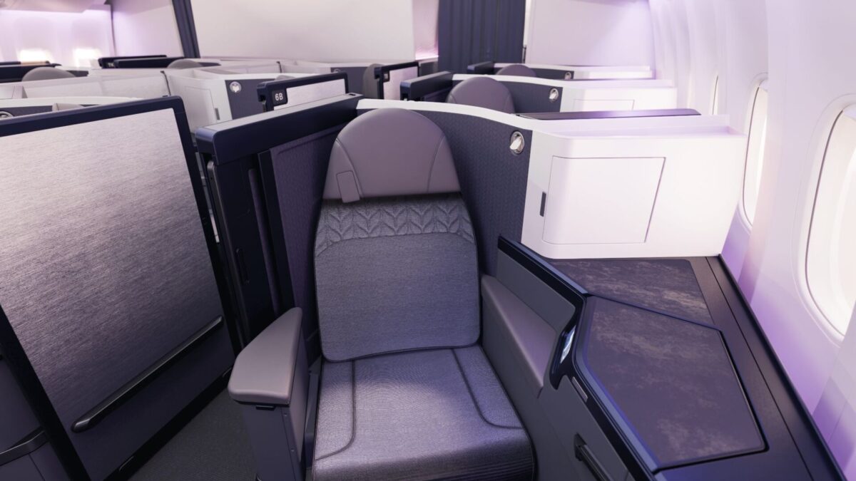 image Premium lie flat airline seat with private enclosed suite and window side wall