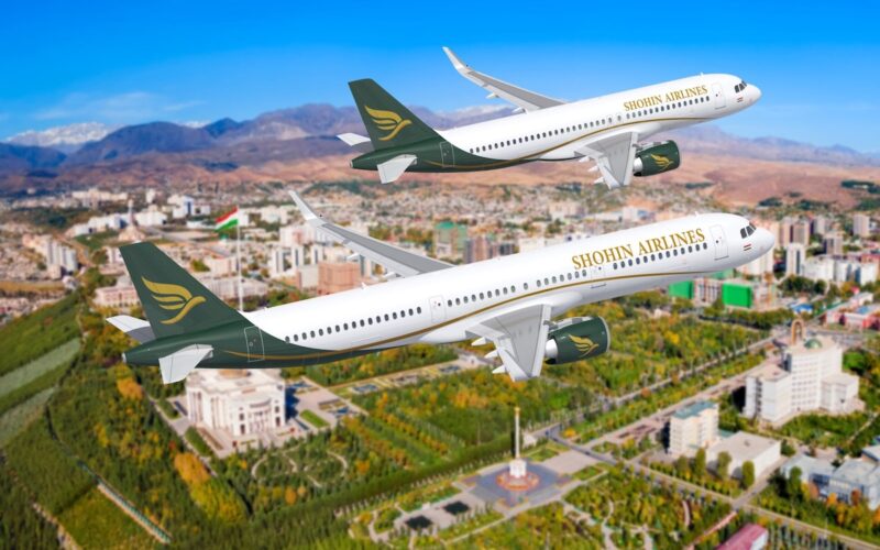 shohin airlines airbus Two Shohin Airlines planes fly in formation over a city with green parks and mountains in the background blue sky overhead