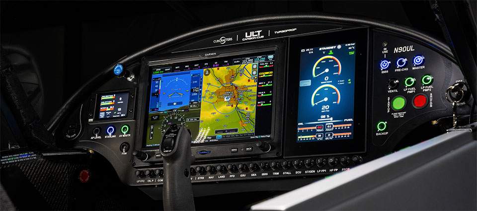 ult panel 960 773f0e0e791e5e7ae7409f0f7dd79eea8f8e57cb7e0dded4e35d5edaca4bd6c2 Cockpit of a modern aircraft with multiple digital flight displays showing navigation map engine gauges and control panel buttons