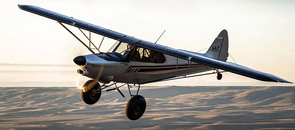 ult sagebrush hills 960 37b7c5208149f5110da6c26b0a42c2beb62784ddb547d311f2809dd3887a769b Small single engine high wing airplane flying low over desert dunes at sunset