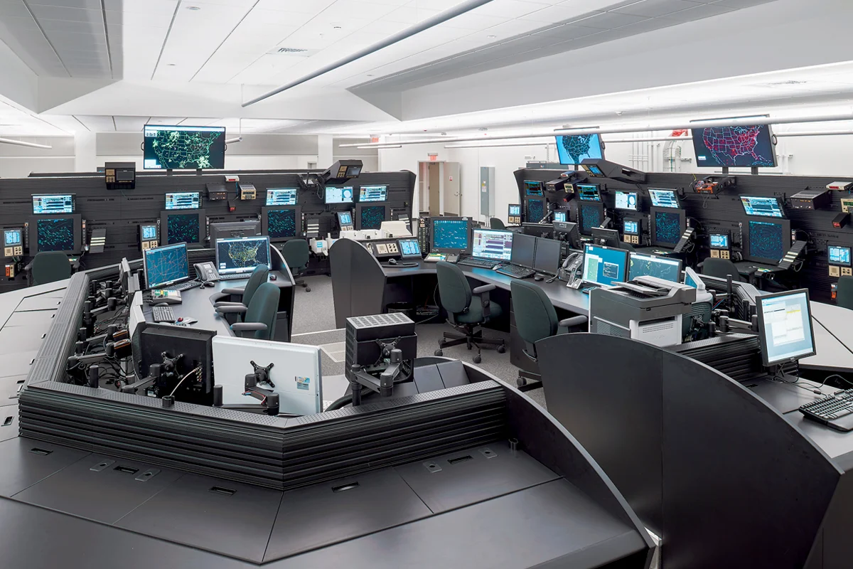 1200x800 tracon 3 Control room filled with workstations and multiple screens displaying maps and data on their monitors