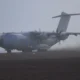 A Royal Air Force Airbus A400M Atlas arrives at Jan Mayensfield Norway carrying US Marines Royal Marines and two JTLVs for Operation Atlantic City 26