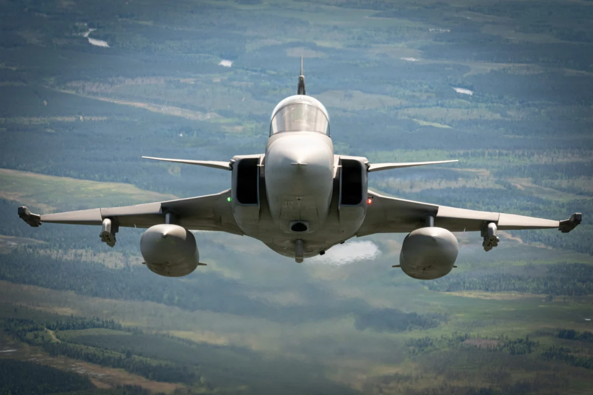 A Swedish Air Force JAS 39 Gripen flies over Finland during Exercise Ramstein Flag on June 16 2026 Front view of a fighter jet flying toward the camera over a green valley