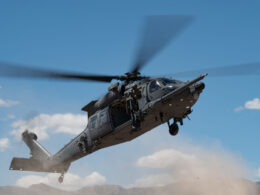 A US Air Force HH 60W Jolly Green II assigned to the 88th Test and Evaluation Squadron flies over Nellis Air Force Base