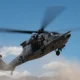 A US Air Force HH 60W Jolly Green II assigned to the 88th Test and Evaluation Squadron flies over Nellis Air Force Base