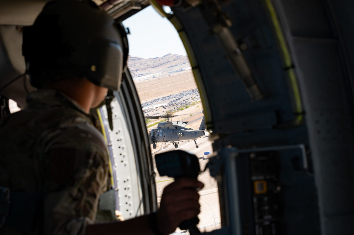 A US Air Force airman looks out of an HH 60W Jolly Green II rescue helicopter A US Air Force airman looks out of an HH 60W Jolly Green II rescue helicopter