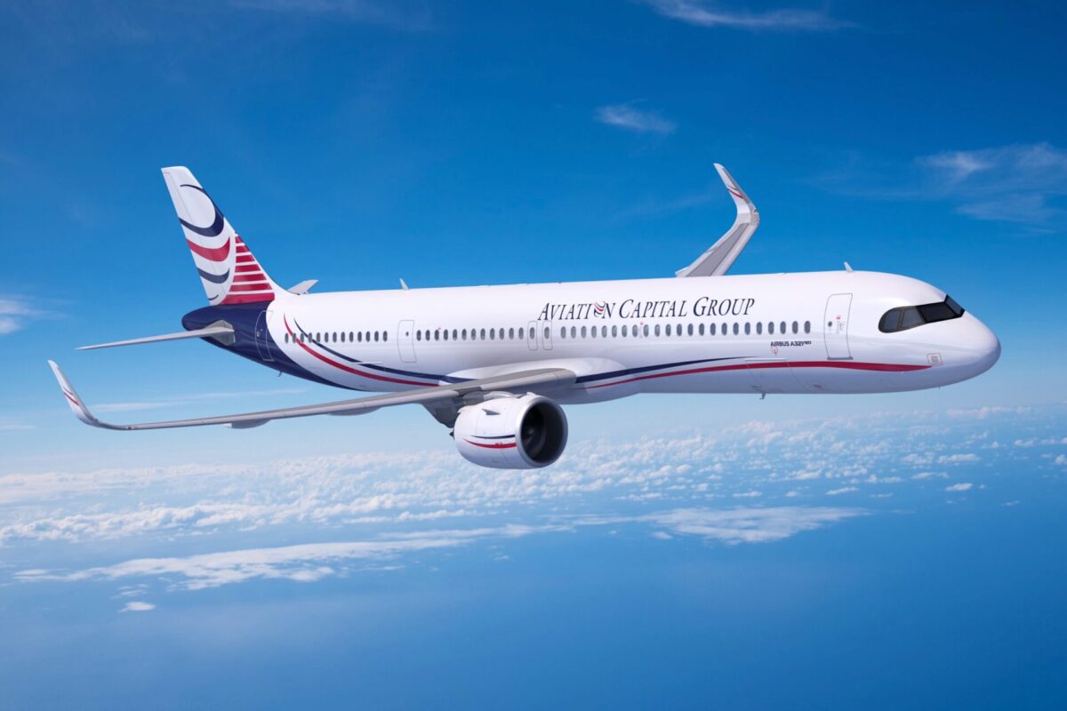 AIRBUS A321XLR OVER WATER scaled Airline jet in white livery with blue and red accents flying above clouds mid flight in clear blue sky