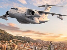 Artists impression of an Embraer KC 390 Millennium in Colombian Aerospace Force colors flying over Bogotá