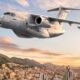Artists impression of an Embraer KC 390 Millennium in Colombian Aerospace Force colors flying over Bogotá