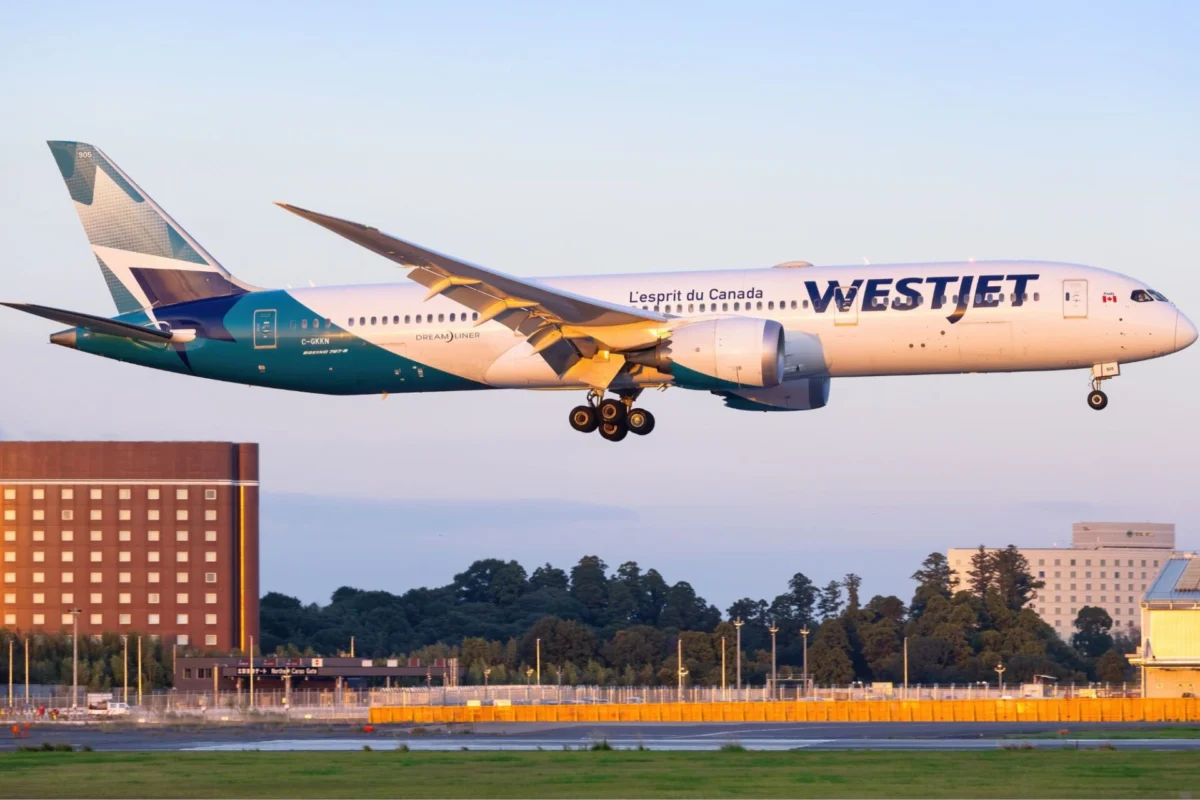 WestJet agrees to US2M settlement in harassment lawsuit WestJet Boeing 787 Dreamliner landing with gear down over the runway during golden hour light tail visible