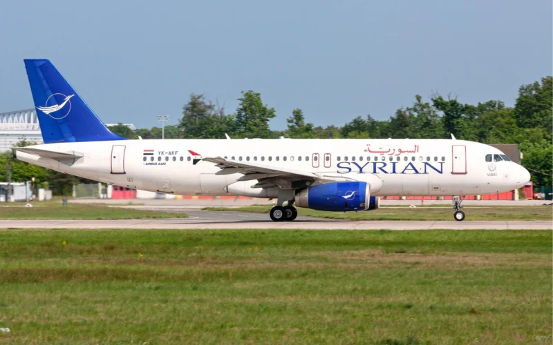 Airbus A320 of Syrian Airlines on taxiway white fuselage with blue SYRIAN lettering and blue tail logo
