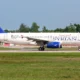 Airbus A320 of Syrian Airlines on taxiway white fuselage with blue SYRIAN lettering and blue tail logo