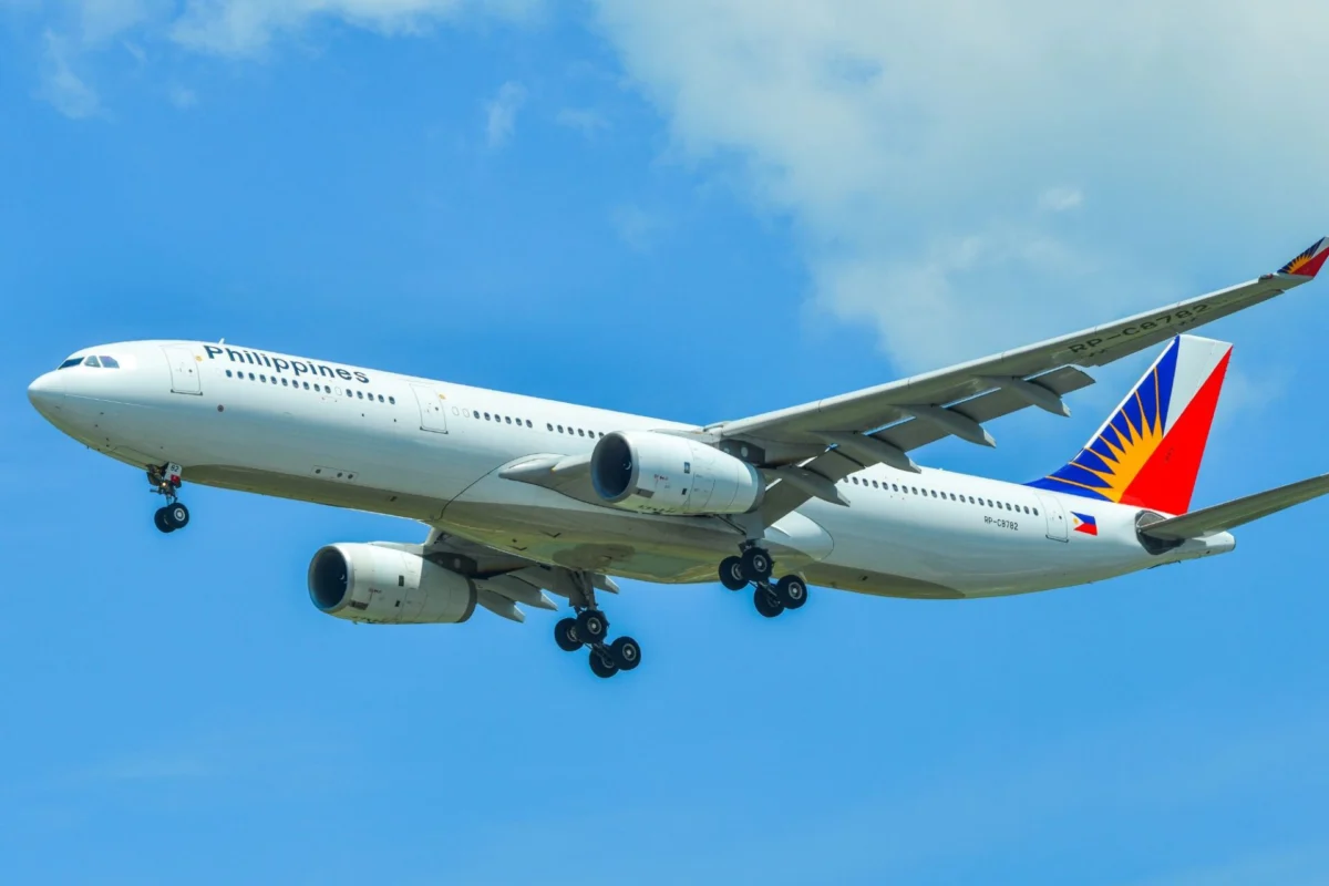 PAL to boost Manila Melbourne to daily flights from November Philippine Airlines wide body airliner in the sky with landing gear extended against a blue backdrop tailfin visible with colorful logo