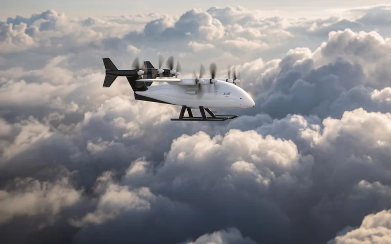 White cargo aircraft with six propellers flying above a cloudy sky labeled Zuri on the fuselage