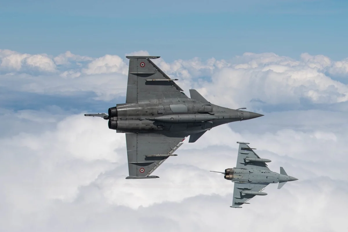 A Dassault Rafale and a Eurofighter Typhoon fly in formation A Dassault Rafale and a Eurofighter Typhoon fly in formation