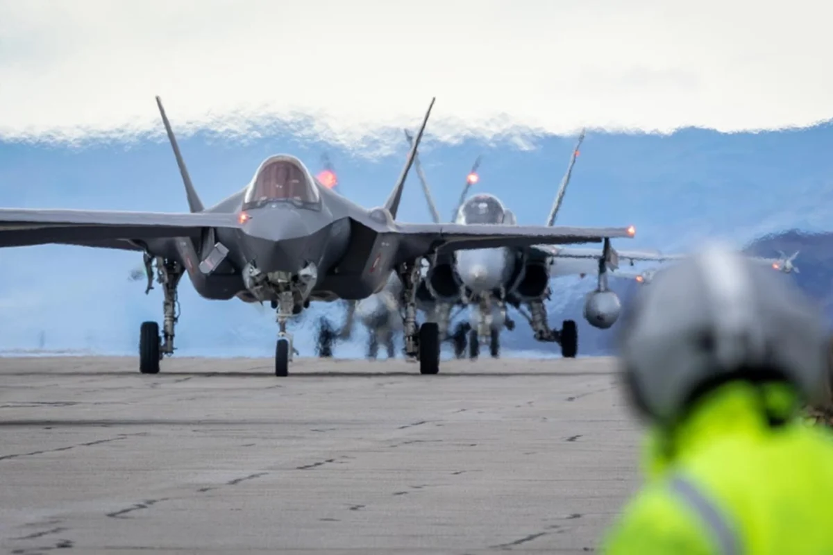 A Royal Danish Air Force F 35A alongside a Royal Canadian Air Force CF 18 at Kangerlussuaq Airport Greenland A Royal Danish Air Force F 35A alongside a Royal Canadian Air Force CF 18 at Kangerlussuaq Airport Greenland