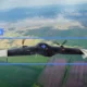A Russian fixed wing drone is tracked by a Ukrainian interceptor system
