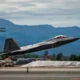 A US Air Force F 22 Raptor assigned to the 90th Fighter Squadron takes off